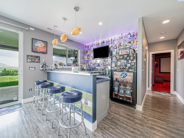 5880 S 58th Ave, West Richland, WA 99353 - community bar area featuring wood finished floors, pendant lighting, recessed lighting, and freestanding refrigerator