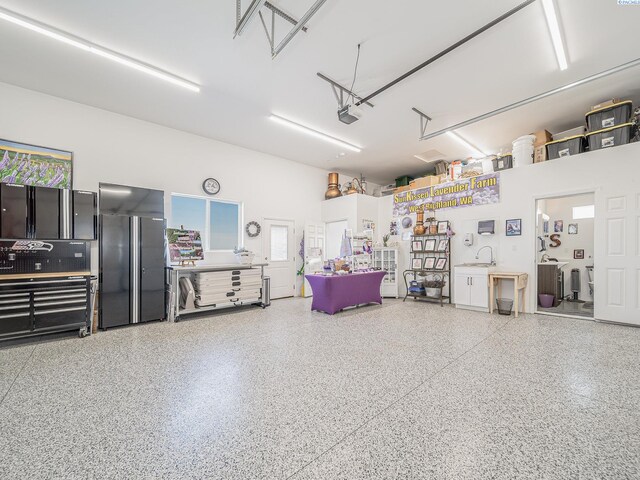 5880 S 58th Ave, West Richland, WA 99353 - garage featuring high quality fridge and a garage door opener