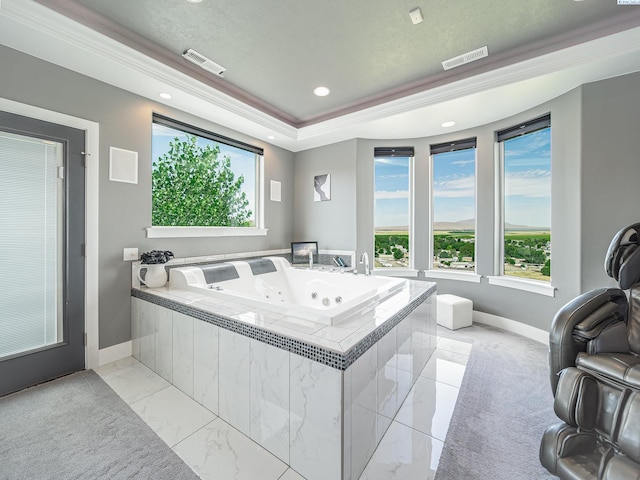 5880 S 58th Ave, West Richland, WA 99353 - bathroom featuring plenty of natural light, a whirlpool tub, a raised ceiling, and crown molding