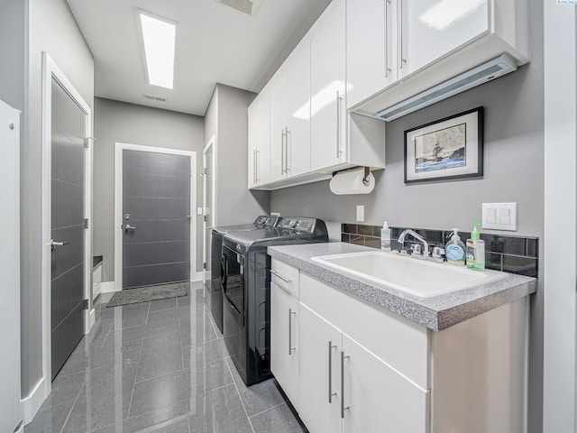 5880 S 58th Ave, West Richland, WA 99353 - laundry area featuring washing machine and clothes dryer, cabinet space, and granite tiled floors