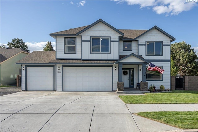 5200 W 28th Ave, Kennewick, WA 99338 - view of front facade with concrete driveway, roof with shingles, and a garage