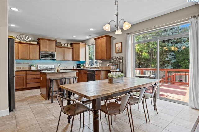 5200 W 28th Ave, Kennewick, WA 99338 - dining area featuring recessed lighting, light tile patterned floors, and a chandelier