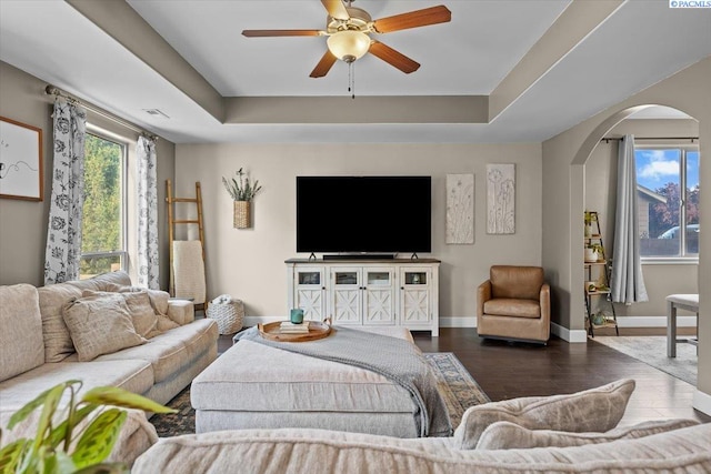 5200 W 28th Ave, Kennewick, WA 99338 - living room with arched walkways, ceiling fan, a raised ceiling, and baseboards