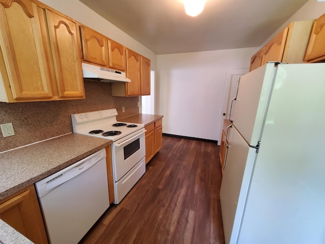 kitchen featuring tasteful backsplash, dark wood finished floors, baseboards, under cabinet range hood, and white appliances