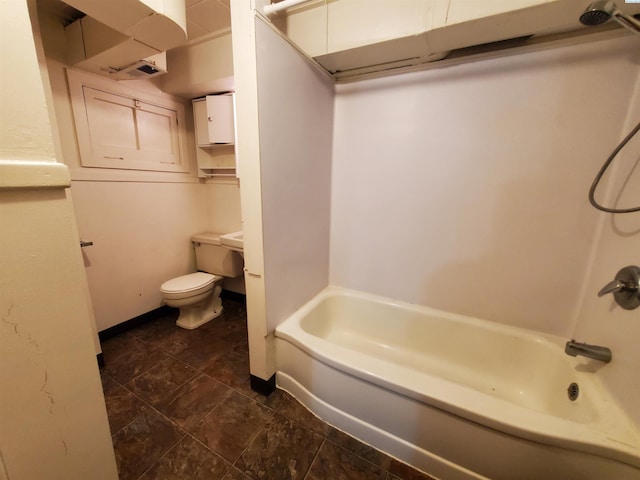 bathroom with bathing tub / shower combination and toilet