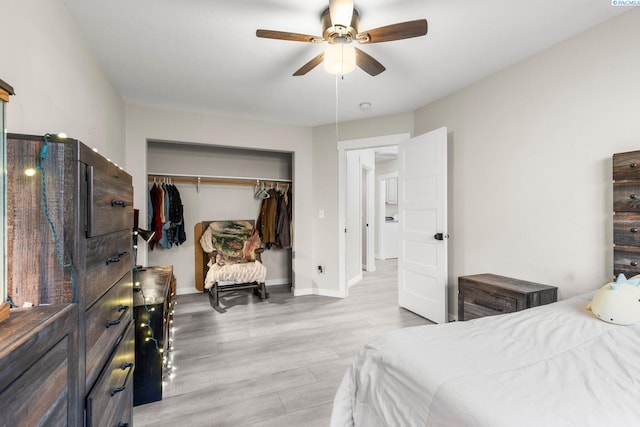 1335 W Grandview Ave, Sunnyside, WA 98944 - bedroom featuring a closet, wood finished floors, baseboards, and ceiling fan