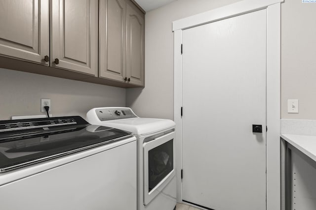 1335 W Grandview Ave, Sunnyside, WA 98944 - laundry area featuring separate washer and dryer and cabinet space
