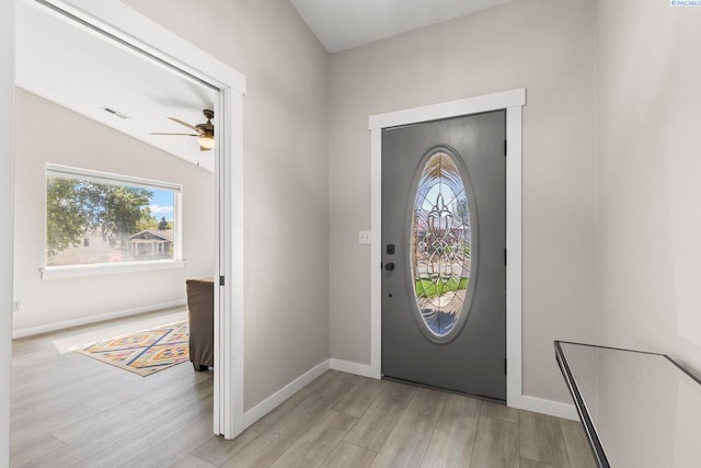 1335 W Grandview Ave, Sunnyside, WA 98944 - foyer entrance with light wood-style flooring, a ceiling fan, vaulted ceiling, and baseboards