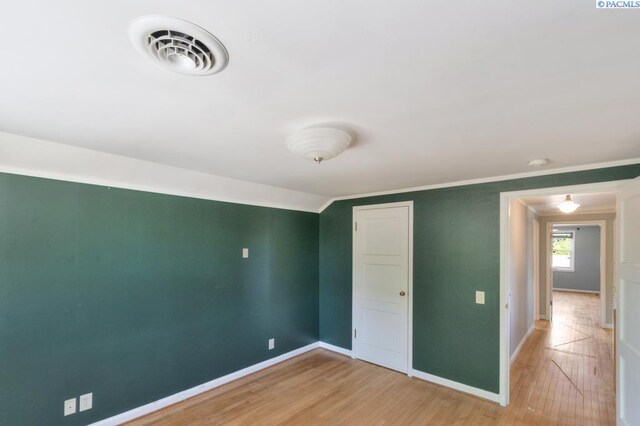 1935 Harris Ave, Richland, WA 99354 - unfurnished bedroom with light wood-style floors and crown molding