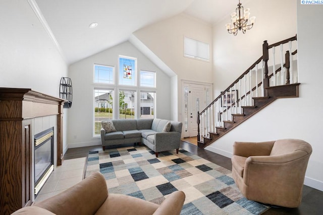 970 SW Itani Dr, Pullman, WA 99163 - living area featuring a fireplace, a chandelier, high vaulted ceiling, baseboards, and stairs
