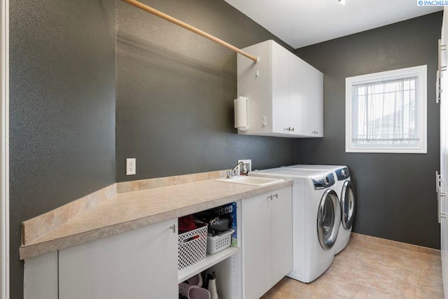 970 SW Itani Dr, Pullman, WA 99163 - washroom featuring cabinet space, washing machine and dryer, light tile patterned floors, and baseboards