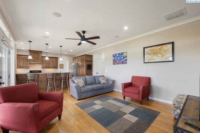 970 SW Itani Dr, Pullman, WA 99163 - living area featuring ceiling fan, light wood-type flooring, baseboards, recessed lighting, and crown molding