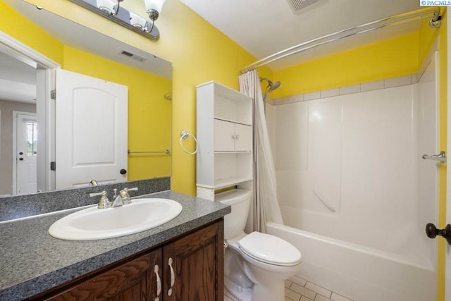 970 SW Itani Dr, Pullman, WA 99163 - full bath featuring toilet, shower / bath combo with shower curtain, vanity, and tile patterned flooring
