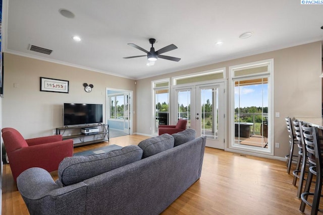 970 SW Itani Dr, Pullman, WA 99163 - living area with french doors, ceiling fan, ornamental molding, plenty of natural light, and light wood finished floors
