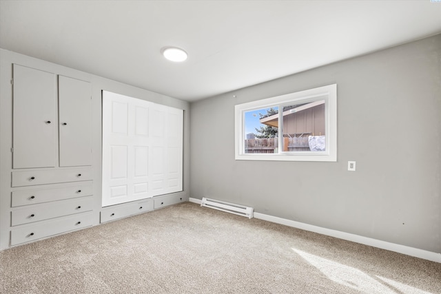 447 S Wilbur Ave, Walla Walla, WA 99362 - unfurnished bedroom with baseboards, baseboard heating, and carpet flooring