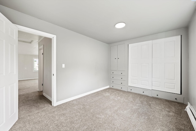 447 S Wilbur Ave, Walla Walla, WA 99362 - unfurnished bedroom featuring baseboard heating, carpet floors, and baseboards