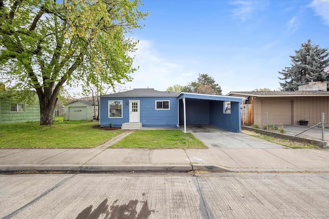 447 S Wilbur Ave, Walla Walla, WA 99362 - ranch-style home featuring driveway, fence, an attached carport, and a front yard