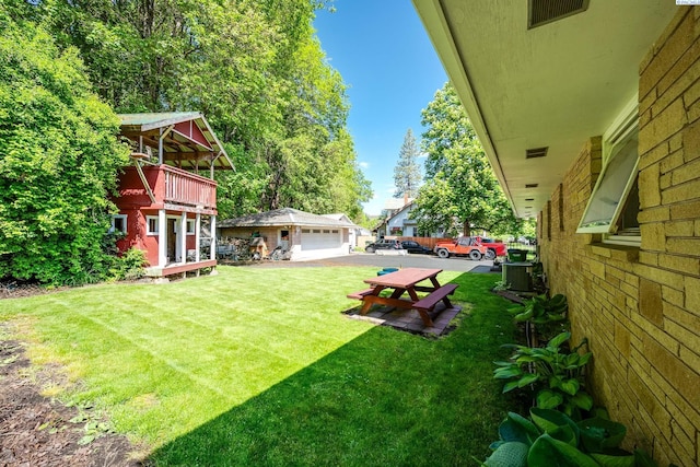 609 N Perkins Ave, Colfax, WA 99111 - view of grassy yard featuring a garage and central air condition unit