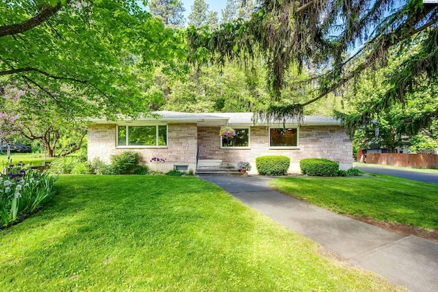 609 N Perkins Ave, Colfax, WA 99111 - ranch-style home featuring a front lawn and stone siding