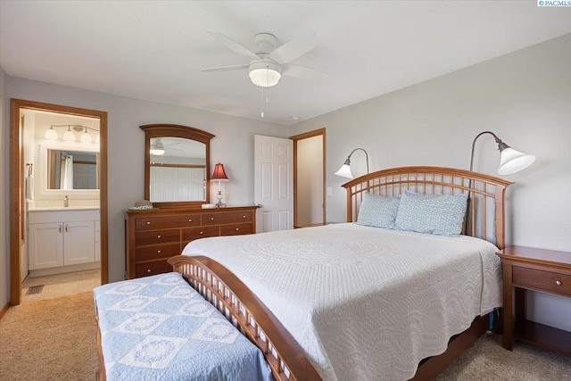 96604 E Clover Rd, Kennewick, WA 99338 - bedroom with light carpet, connected bathroom, and a ceiling fan