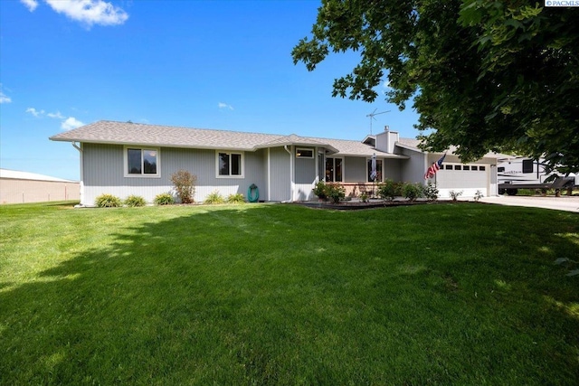 96604 E Clover Rd, Kennewick, WA 99338 - ranch-style home with driveway, an attached garage, a front yard, and a chimney
