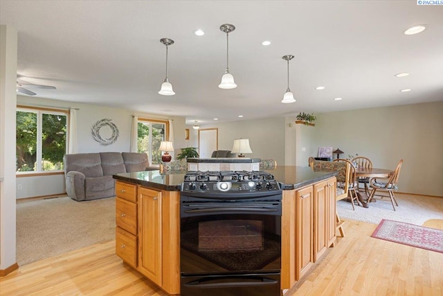 96604 E Clover Rd, Kennewick, WA 99338 - kitchen featuring black range with gas stovetop, open floor plan, light wood-style floors, pendant lighting, and recessed lighting