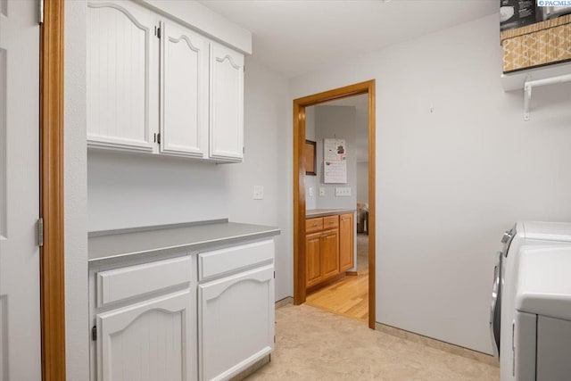 96604 E Clover Rd, Kennewick, WA 99338 - laundry room with separate washer and dryer, cabinet space, and light flooring