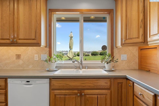96604 E Clover Rd, Kennewick, WA 99338 - kitchen featuring dishwasher, backsplash, brown cabinets, and light countertops