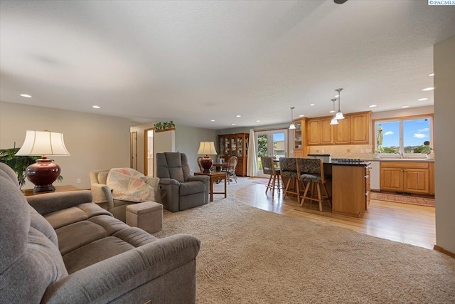 96604 E Clover Rd, Kennewick, WA 99338 - living area with recessed lighting, light wood finished floors, and light colored carpet