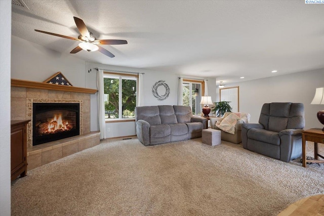 96604 E Clover Rd, Kennewick, WA 99338 - living area featuring carpet floors, a tile fireplace, and ceiling fan