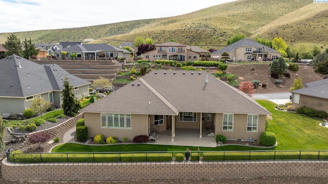 birds eye view of property with a mountain view and a residential view