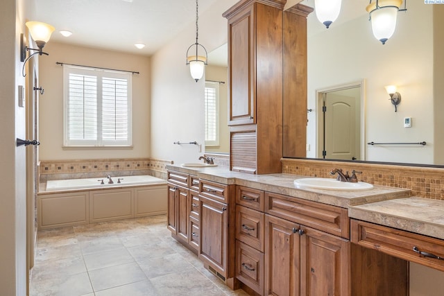 full bath with backsplash, double vanity, a sink, and a garden tub