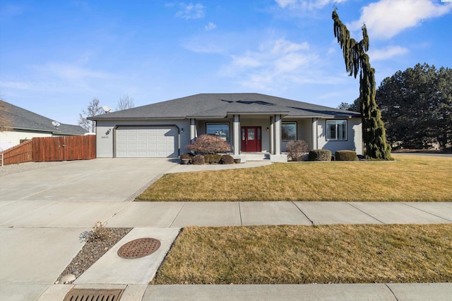 view of front facade featuring a garage and a front lawn