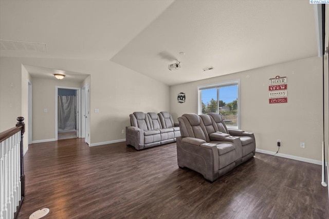 living room with lofted ceiling, dark wood-style floors, and baseboards
