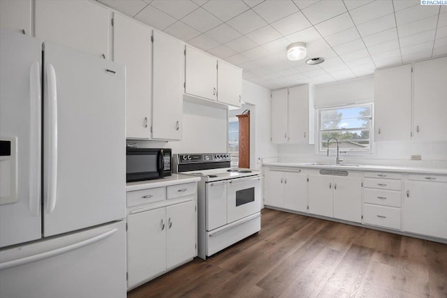 1001 Wilson St, Richland, WA 99354 - kitchen featuring white appliances, white cabinets, light countertops, and dark wood finished floors