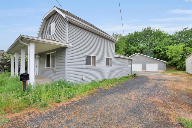 807 N Main St, Colfax, WA 99111 - view of side of property with a detached garage and an outbuilding