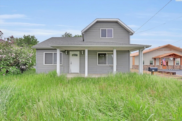 807 N Main St, Colfax, WA 99111 - view of front of property with covered porch and a shingled roof