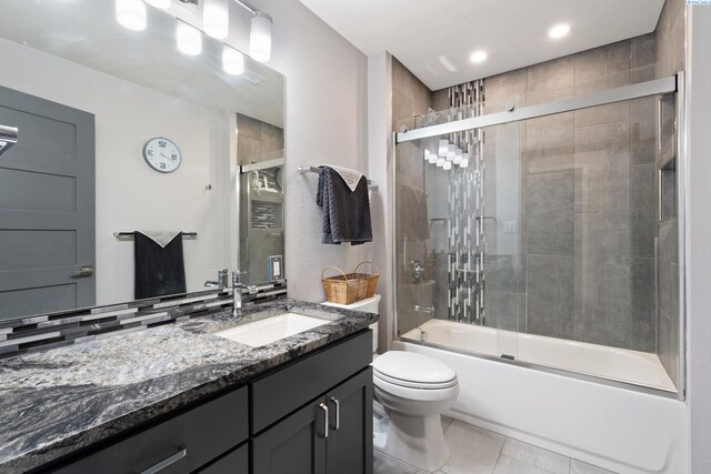 9115 W Maple Dr, Pasco, WA 99301 - full bath featuring vanity, combined bath / shower with glass door, tile patterned flooring, and recessed lighting