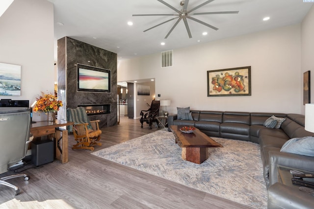 9115 W Maple Dr, Pasco, WA 99301 - living area featuring ceiling fan, wood finished floors, a high end fireplace, and recessed lighting