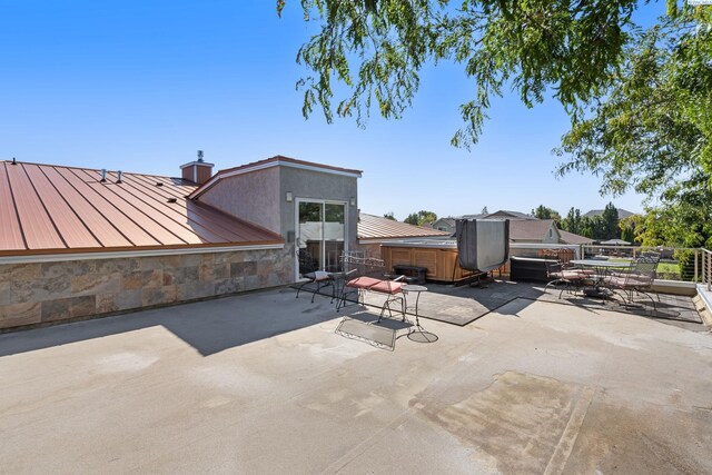 9115 W Maple Dr, Pasco, WA 99301 - view of patio / terrace with a hot tub