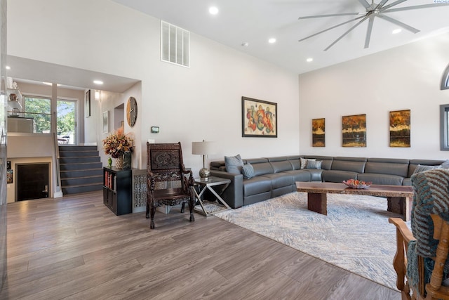 9115 W Maple Dr, Pasco, WA 99301 - living room featuring a ceiling fan, a high ceiling, wood finished floors, and recessed lighting