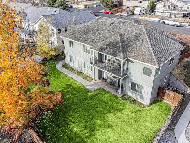 birds eye view of property with a residential view