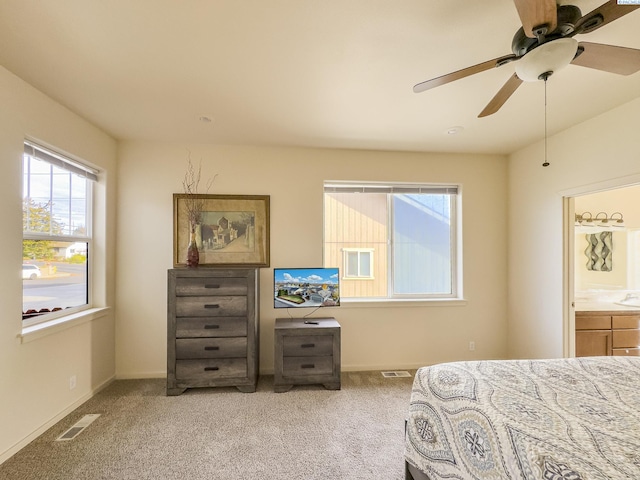 bedroom featuring baseboards, visible vents, ceiling fan, and carpet flooring