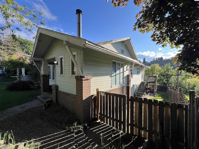 408 S Mill St, Colfax, WA 99111 - view of property exterior with brick siding, stairway, and a deck