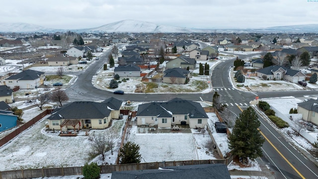 snowy aerial view with a mountain view