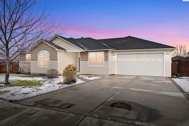 ranch-style house featuring a garage