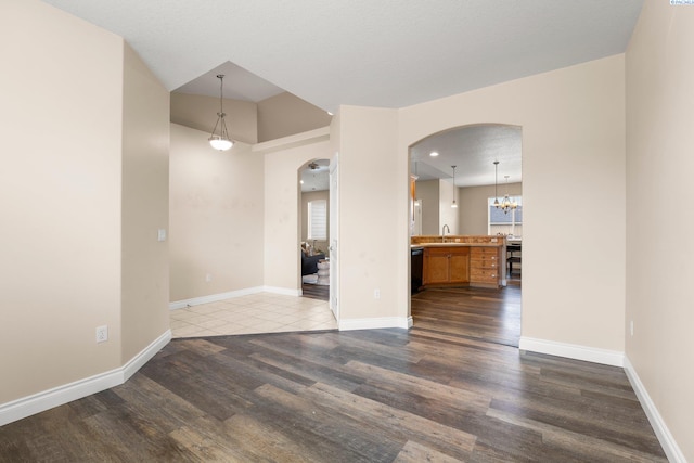 empty room with sink and wood-type flooring