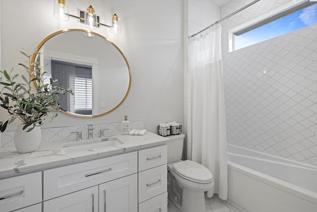 full bathroom featuring vanity, toilet, and shower / bath combo with shower curtain