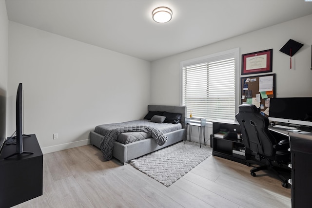 bedroom with light wood-type flooring