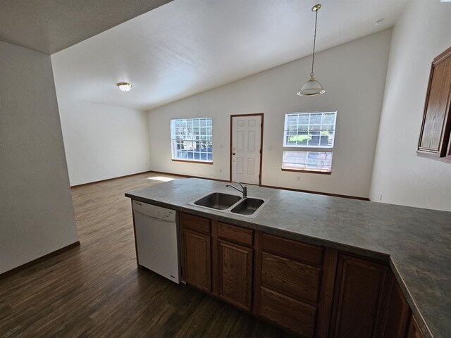 1135-1137 NE Indiana St, Pullman, WA 99163 - kitchen with dark countertops, vaulted ceiling, a sink, and dishwasher